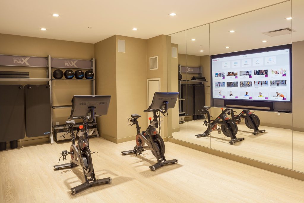 Fitness studio with stationary bicycles.