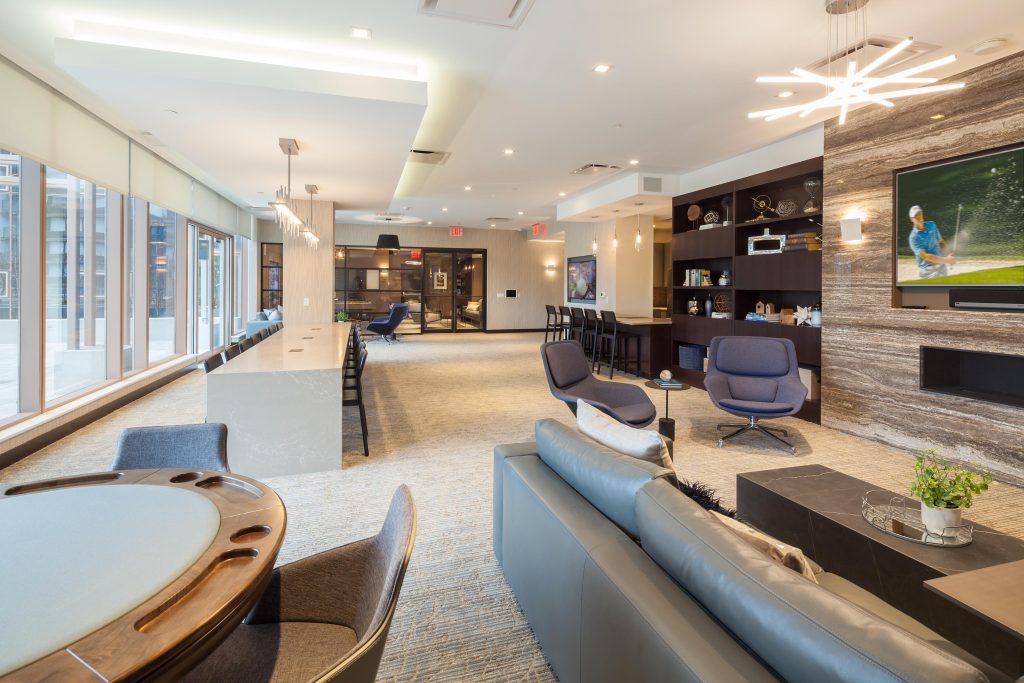 Lounge with TV and poker table.